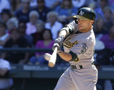 Sam Fuld slugs a solo home run in the first inning, the A’s only hit until the sixth inning. (Associated Press)