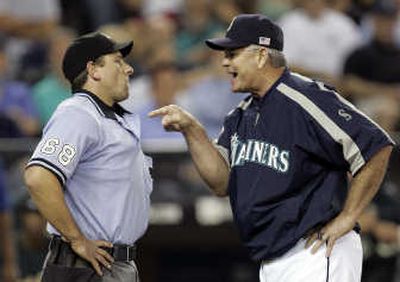 
M's manager John McLaren makes a point with plate umpire Chris Guccione. Associated Press
 (Associated Press / The Spokesman-Review)