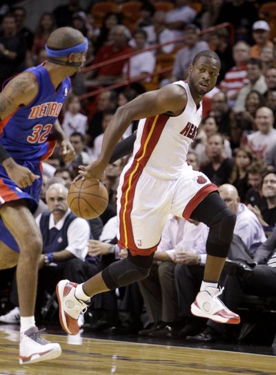 Dwyane Wade, right, lasted 3:17 in preseason game for Heat.  (Associated Press)
