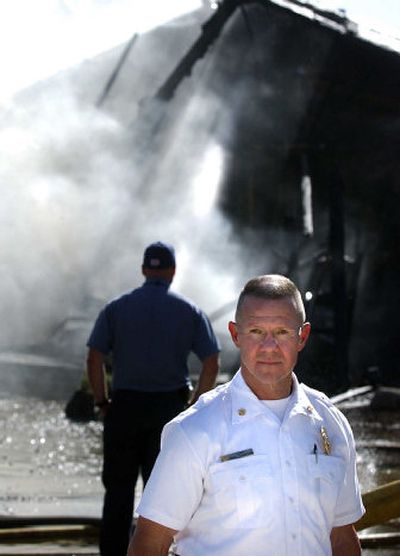 
Spokane Valley Fire Chief Mike Thompson, shown at the the scene of a house fire on the 9700 block of East Whitman in September, wants the department will become the premier fire department in the state.
 (Liz Kishimoto / The Spokesman-Review)