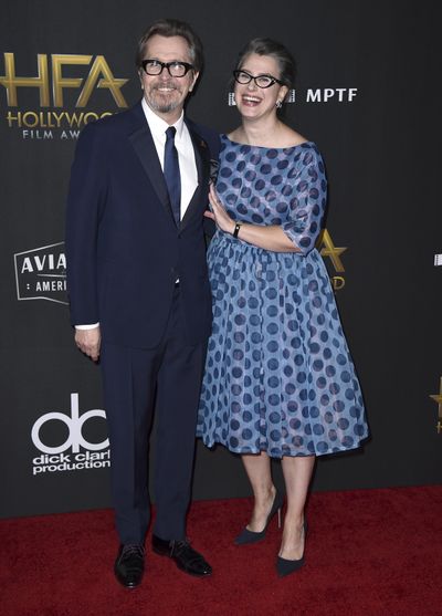 In this Nov. 5, 2017 photo, Gary Oldman, left, and Gisele Schmidt arrive at the Hollywood Film Awards at the Beverly Hilton hotel in Beverly Hills, Calif. (Jordan Strauss / Associated Press)