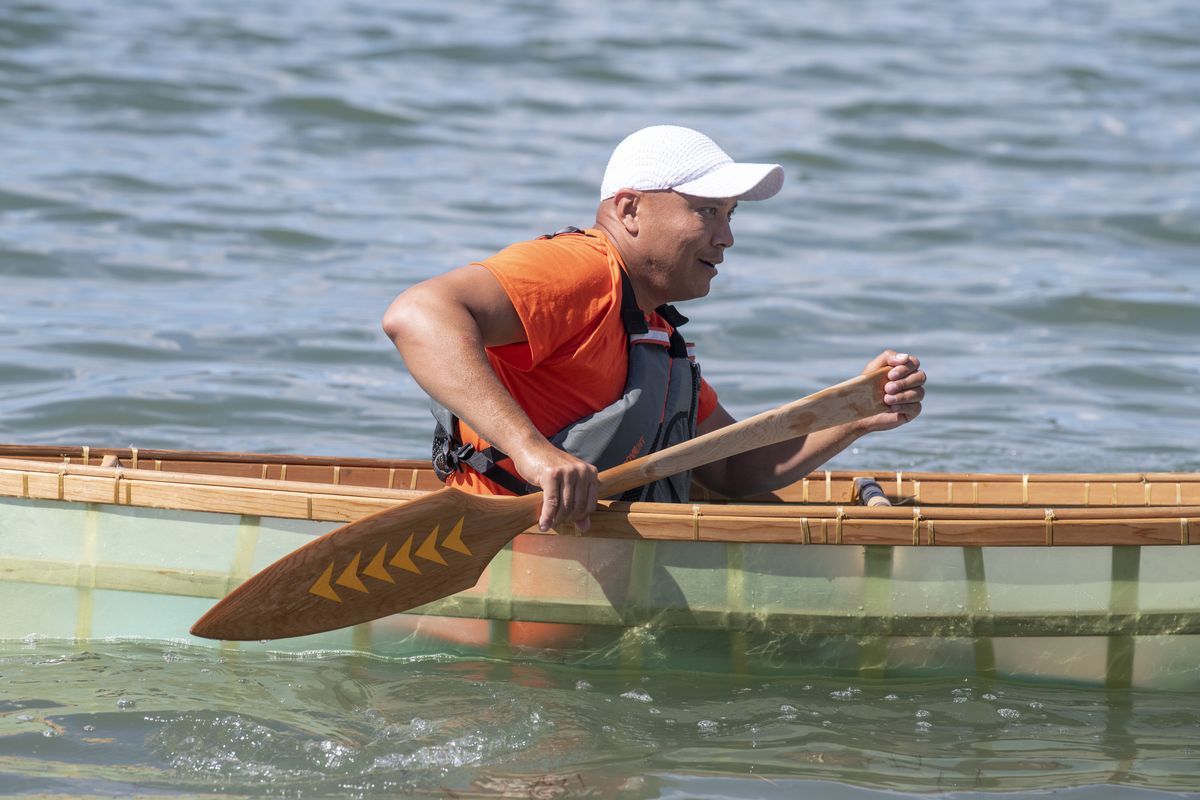 Shawn Brigman paddles one of the canoes he adapted from a traditional Native canoe design except with modern materials, in the waters off the Two Rivers area at the confluence of the Spokane and Columbia Rivers Tuesday, June 15, 2021. He joined a trip by Native youth to learn about their tribes’ history in the area while on a four-hour paddle up the Columbia. They met at nearby Fort Spokane, a military post founded in 1880, but it was also a school to educate Native kids, a process which was not always voluntary.  (Jesse Tinsley/THE SPOKESMAN-REVIEW)