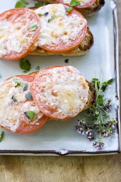 Garlic and rosemary add special flavor to toasted Parmesan tomato bread, an adult update on a perennial family favorite. (Associated Press)