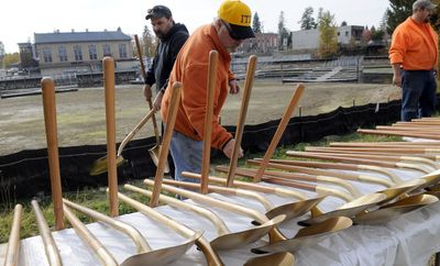 Jack Dewey, front, and Chad Larson of the Idaho Transportation Department prepare the shovels for a groundbreaking ceremony for the Sand Creek Byway in Sandpoint on Thursday.  (Kathy Plonka / The Spokesman-Review)