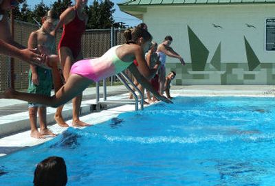 
Nine-year- old Hailie Knapp practices diving during a swim lesson Tuesday at Park Pool in Spokane Valley. 
 (Liz Kishimoto / The Spokesman-Review)