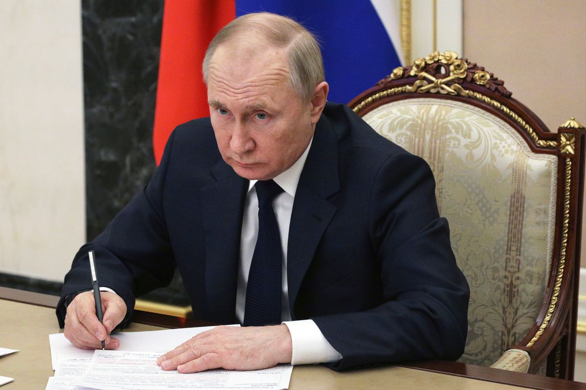 FILE - Russian President Vladimir Putin chairs a meeting with members of the government via teleconference in Moscow, Thursday, March 10, 2022.  (Mikhail Klimentyev)