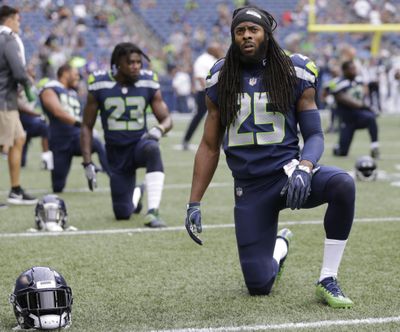 In this Aug. 18, 2017, file photo, Seattle Seahawks cornerback Richard Sherman (25) stretches during warm ups before an NFL football preseason game against the Minnesota Vikings in Seattle. (Stephen Brashear / Associated Press)