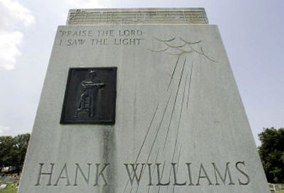 
The tombstone at the grave of country music legend Hank Williams is shown in Montgomery, Ala. An estimated 100,000 people stop by the hilltop grave site where Williams is buried next to his wife, Audrey.
 (Associated Press photos / The Spokesman-Review)