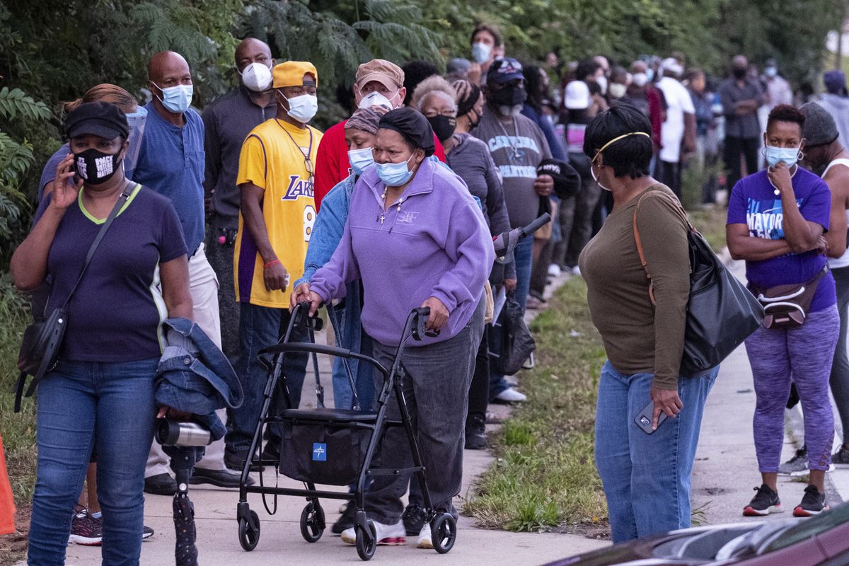 People wait in line to vote in Decatur, Ga., Monday, Oct. 12, 2020.  (Ben Gray)