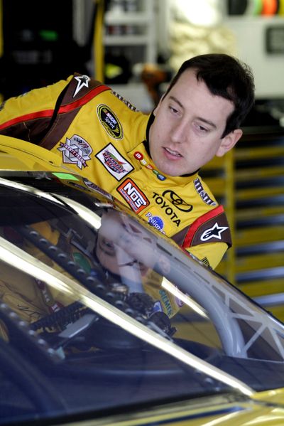 Kyle Busch is ready for another season as he climbs into his car on Friday. (Associated Press)