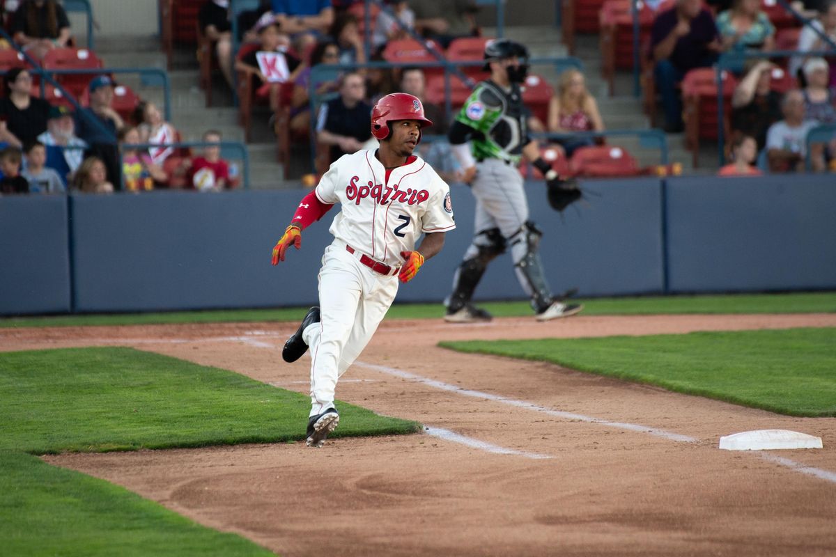 Spokane Indians second baseman Troy Dixon gets a hit and rounds first base against the Eugene Emeralds on July 11, 2018 at Avista Stadium. The Indians beat the Emeralds 8-7. (Libby Kamrowski / The Spokesman-Review)