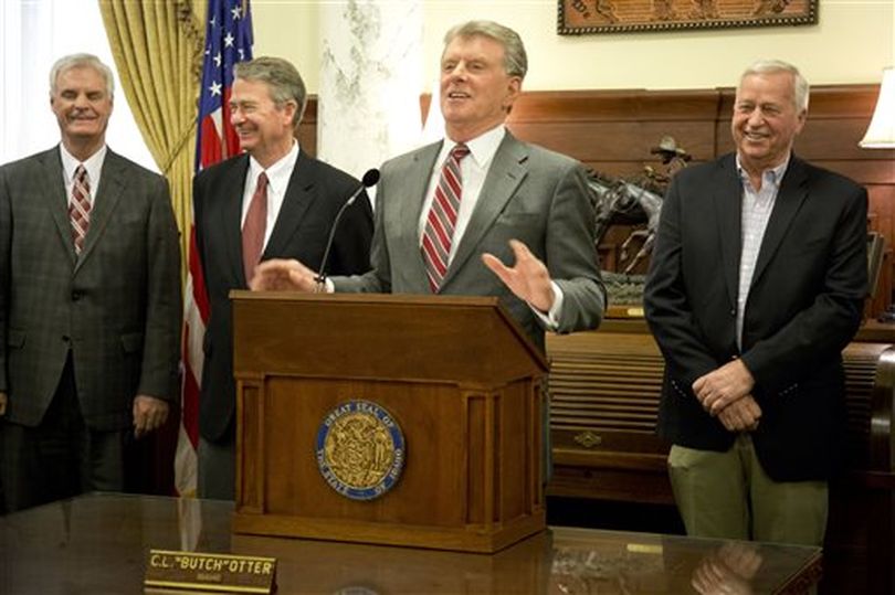 Gov. Butch Otter, center discusses Idaho's just-concluded legislative session on Monday; from left are Senate President Pro-Tem Brent Hill, Lt. Gov. Brad Little, and on the right, House GOP Caucus Chair Rep. John VanderWoude, R-Meridian. (AP/Idaho Statesman / Katherine Jones)