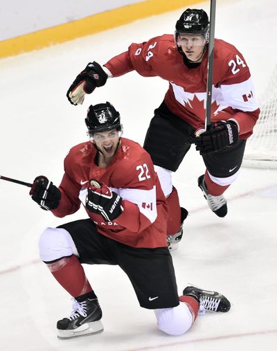 Canada’s Jamie Benn, left, celebrates with Jeff Carter after scoring the only goal of Friday’s semifinal against the United States. (Associated Press)
