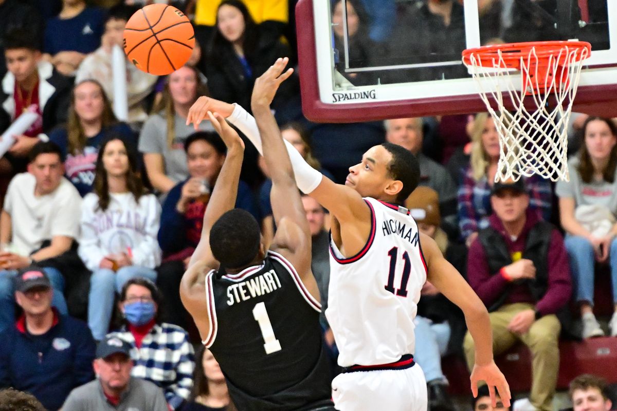 Gonzaga Bulldogs guard Nolan Hickman (11) blocks Santa Clara Broncos guard Carlos Stewart (1) during the second half of a college basketball game on Saturday, Jan. 7, 2023, at Leavey Center in Santa Clara, Calif. Gonzaga won the game 81-76.  (Tyler Tjomsland/The Spokesman-Review)