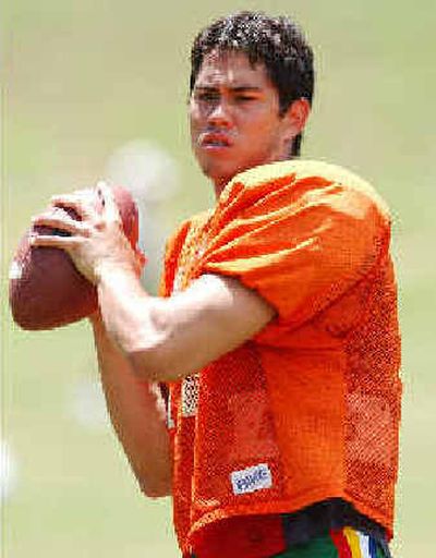 Hawaii senior quarterback Timmy Chang needs 2,218 yards to break Ty Detmer's 13-year-old NCAA career passing mark of 15,031.
(Associated Press / The Spokesman-Review)
