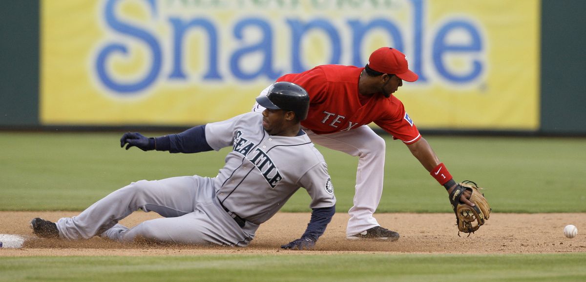 Ken Griffey Jr. of the Mariners arrives at second base with a double. (Associated Press / The Spokesman-Review)
