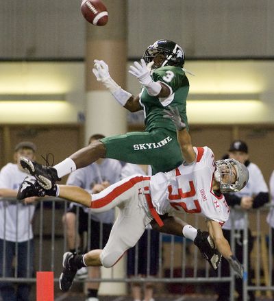 Ferris' Gage Orosco, below, breaks up a pass meant for Skyline's Kasen Williams in the 2009 state title game. Williams will play for Washington next season. (Patrick Hagerty / Special to The Spokesman-Review)