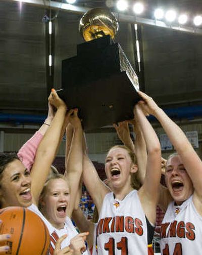 Garfield-Palouse players show off their State 1B championship trophy. Associated Press
 (Associated Press / The Spokesman-Review)
