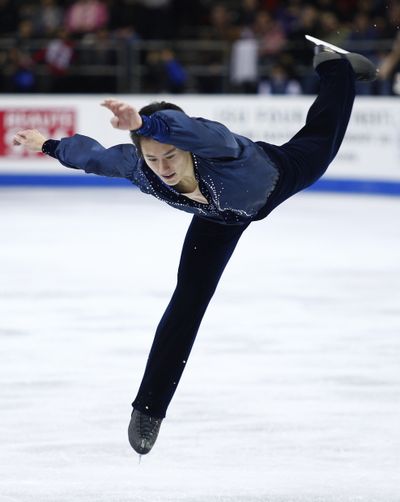 Men’s gold medalist Canada’s Patrick Chan performs his free skate.  (Associated Press / The Spokesman-Review)