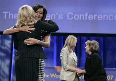 
Ann Romney and Michelle Obama hug as Jeri Thompson and Elizabeth Edwards, far right, greet each other Tuesday at the California Governor and First Lady's Conference on Women in Long Beach, Calif.Associated Press
 (Associated Press / The Spokesman-Review)