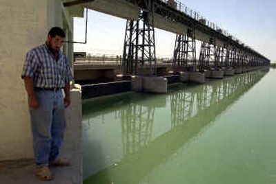 
Marwan Hassounlooks to the spot in Samarra, Iraq, Tuesday where his cousin Zaidoun Faleh Hassoun drowned after U.S. soldiers reportedly pushed him into the water on Jan. 3.
 (Associated Press / The Spokesman-Review)