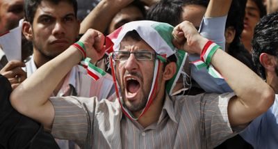 A supporter of Iranian President Mahmoud Ahmadinejad chants at his final election campaign rally Wednesday  in Tehran, Iran.  (Associated Press / The Spokesman-Review)