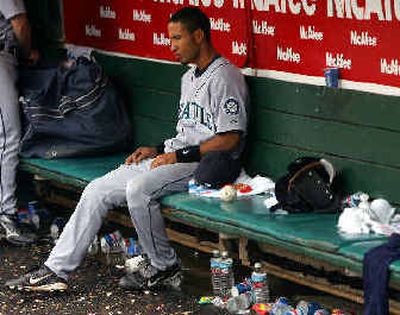 
Seattle's Wilson Valdez sits alone in the dugout after his team's 6-5 loss to Oakland in extra innings on Saturday. 
 (Associated Press / The Spokesman-Review)