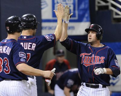 Associated Press Minnesota’s Michael Cuddyer hit for the cycle Friday, the second Twins player to do so this season. (Associated Press / The Spokesman-Review)