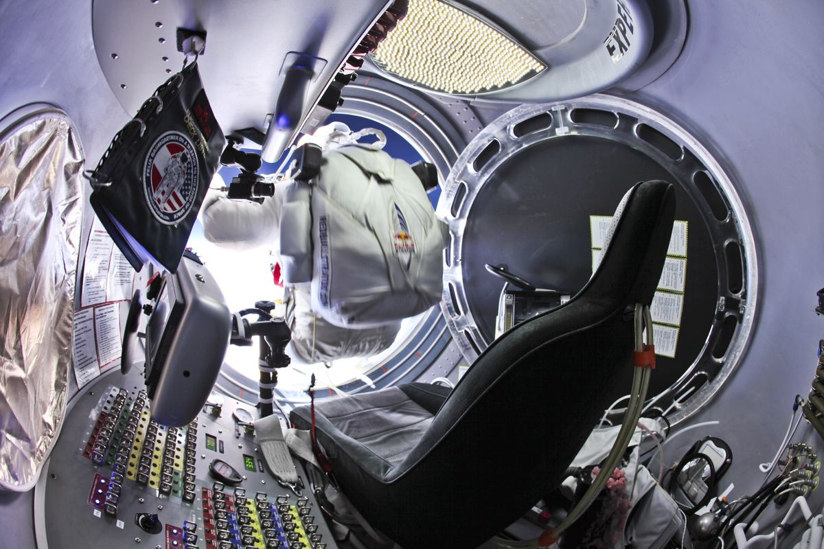 This photo provided by Red Bull Stratos shows pilot Felix Baumgartner, of Austria, preparing to jump from the capsule during the final manned flight for Red Bull Stratos, Sunday, Oct. 14, 2012. In a giant leap from more than 24 miles up, Baumgartner shattered the sound barrier Sunday while making the highest jump ever � a tumbling, death-defying plunge from a balloon to a safe landing in the New Mexico desert. (Jay Nemeth / Red Bull Stratos)