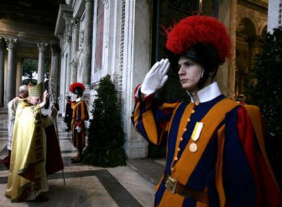 
Pope Benedict XVI is saluted by Swiss Guards as he arrives at St Peter's Basilica to preside over a Mass on Wednesday in Rome. 
 (Associated Press / The Spokesman-Review)