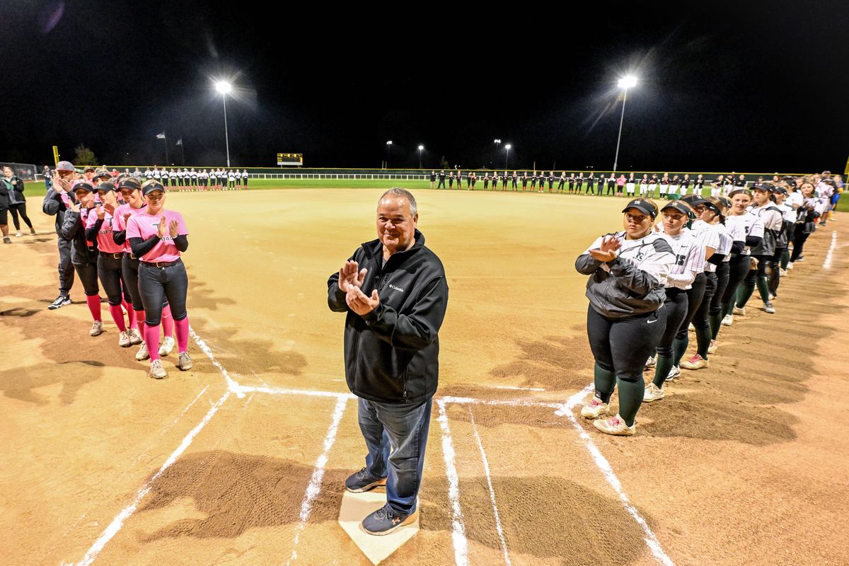 With Greater Spokane League slowpitch teams gathered on the field, Ken VanSickle, former University HS athletic director and league commissioner, is honored Tuesday night at Merkel Sports Complex for reintroducing slowpitch to the league and state.  (COLIN MULVANY)