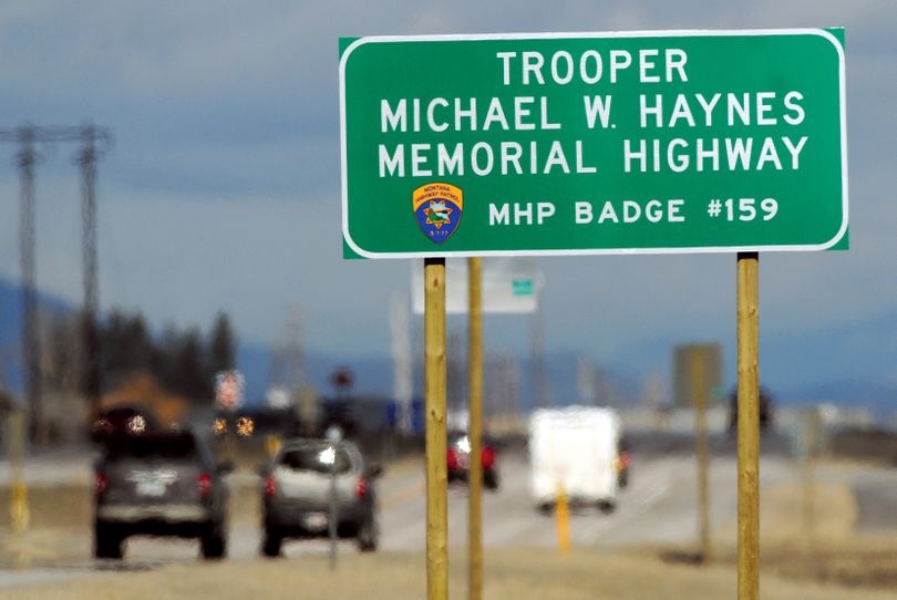 Traffic moves north along U.S. Highway 93 past the Michael Haynes memorial highway sign located near the intersection of Highway 93 and State Highway 82 south of Kalispell, Mont., on March 17, 2010. March 2010 marks the one-year-anniversary of Trooper Haynes' death. A drunk driver traveling north in the wrong lane on U.S. Highway 93 just south of Kalispell while on duty struck trooper Haynes who died four days after the impact. (Lido Vizzutti / Flathead Beacon)