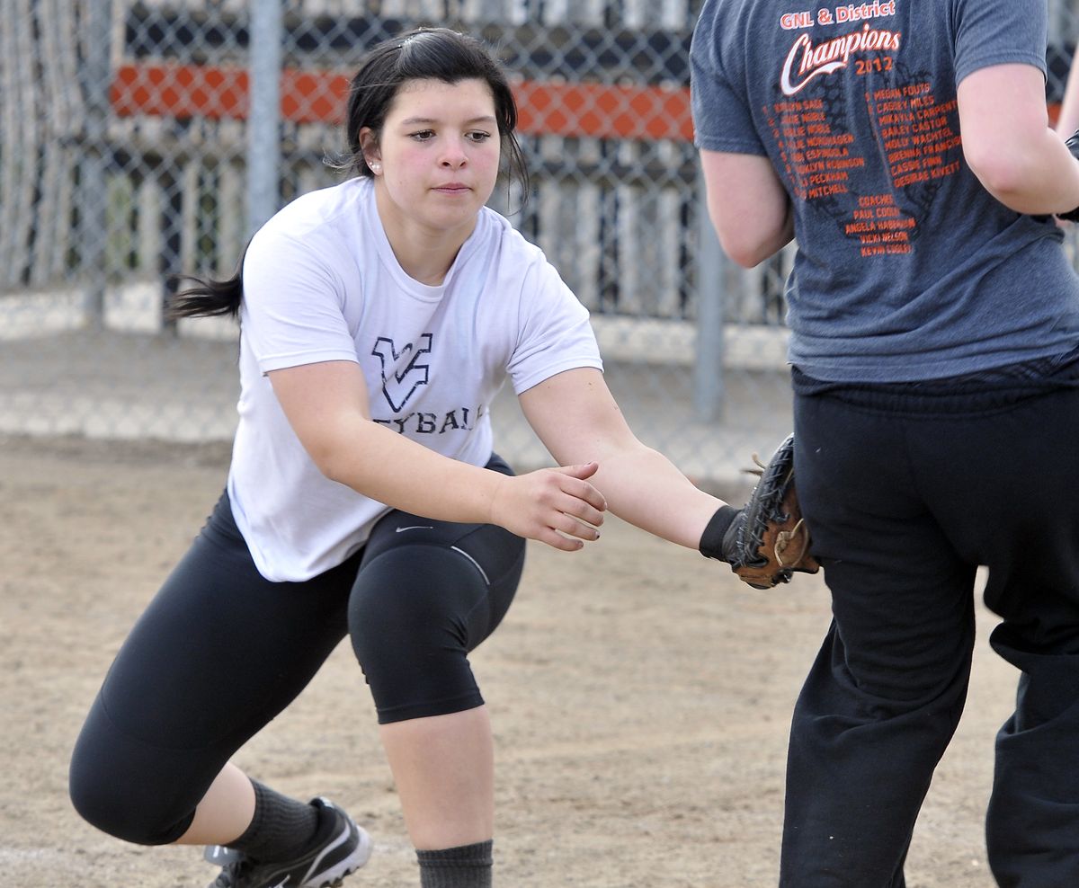 Junior Katelyn Sage, the returning catcher for the West Valley Eagles softball team, tags a teammate during practice Wednesday at Smith Field near West Valley High School. The Eagles took third in state last year and return all but two of their starters this year. (Jesse Tinsley)