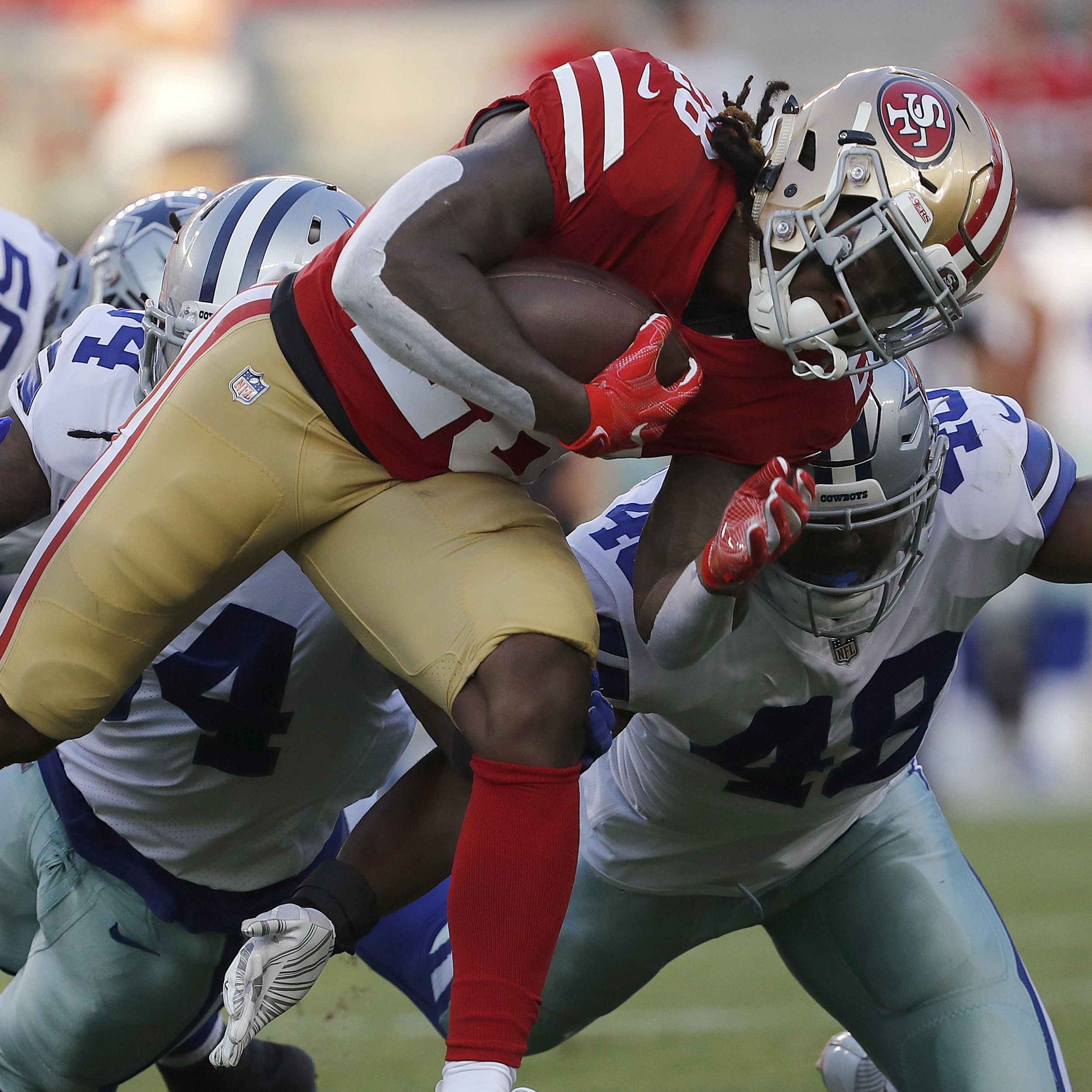 Running back Jerick McKinnon practices for 49ers