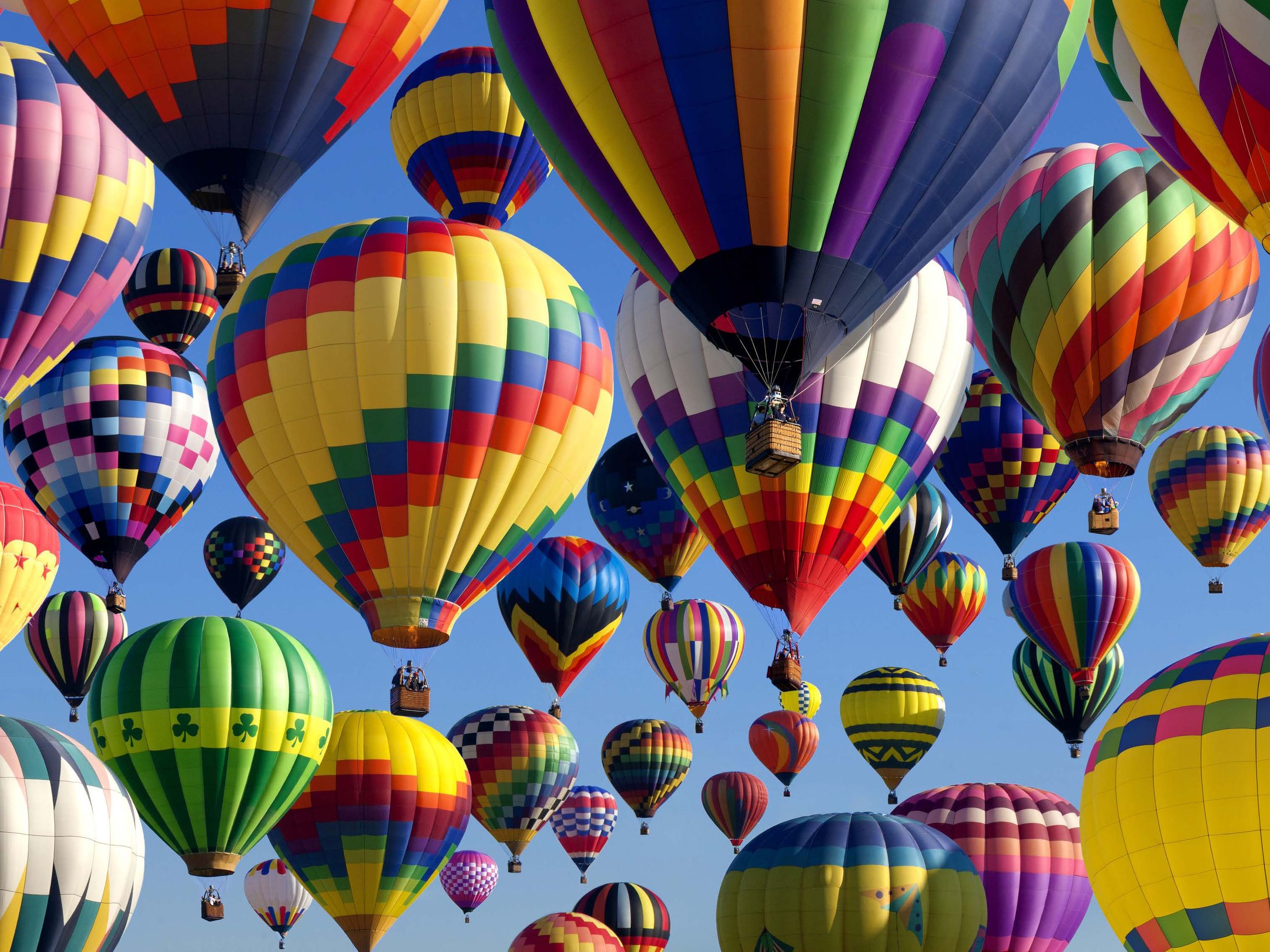 Colorful hot air balloons flying at the Albuquerque Balloon Festival 2026