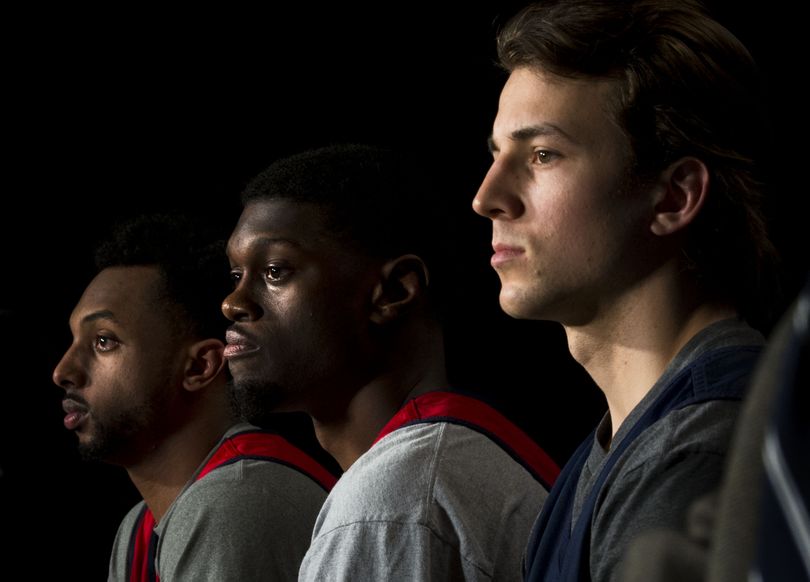 Left to right, Gonzaga guards Byron Wesley (22), Gary Bell Jr. (5), and Kevin Pangos (4) speak to the media before practice for an NCAA college basketball tournament second-round game in Seattle, Thursday, March 19, 2015. Gonzaga will face North Dakota State on Friday. (The Spokesman-Review)