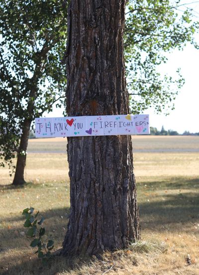 A thank you sign for firefighters working on the Idler Fire near Moscow, Idaho, hangs on a tree.  (Courtesy of the Idaho Department of Lands)