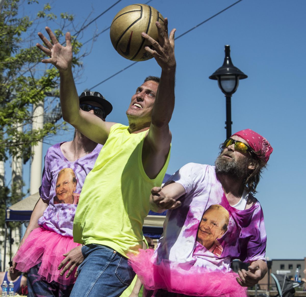 Hank Hendriksen, center of the Gonzaga Bulldogs, battles David Emerson, left, and Chris Banning of the Mamas Boyz for a rebound during a Hoopfest game, June 24, 2017, in the Special Olympics division. (Dan Pelle / The Spokesman-Review)