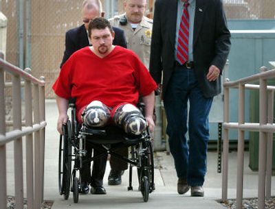 Barry McAdoo, who was sentenced Thursday to life in prison for killing his 15-month-old son, is shown being wheeled into court in March for his preliminary hearing. In a suicide attempt, McAdoo passed out in the snow and both of his feet were severely frostbitten and later amputated.
(File/ / The Spokesman-Review)