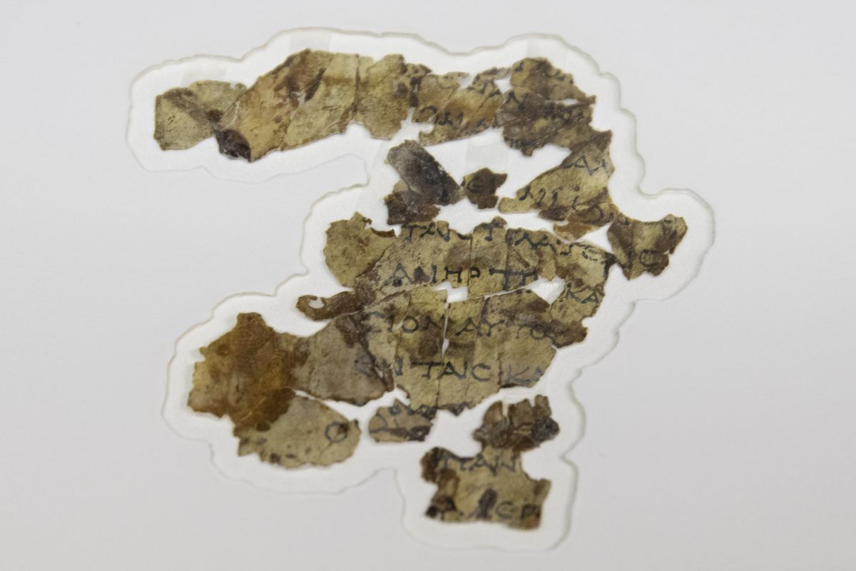The Israel Antiquities Authority displays newly discovered Dead Sea Scroll fragments at the Dead Sea scrolls conservation lab in Jerusalem, Tuesday, March 16, 2021. Israeli archaeologists on Tuesday announced the discovery of dozens of new Dead Sea Scroll fragments bearing a biblical text found in a desert cave and believed hidden during a Jewish revolt against Rome nearly 1,900 years ago.  (Sebastian Scheiner)