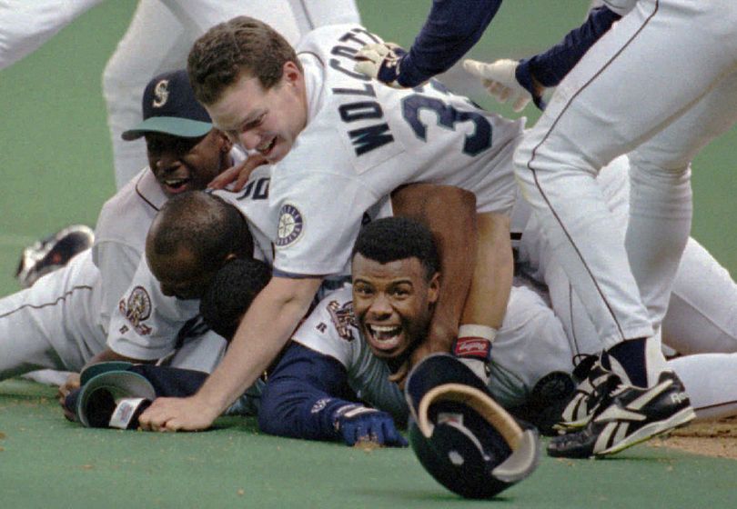 Photo: Seattle Mariners' Ken Griffey, Jr., waits at first base after being  walked against the Los Angeles Angels. - SEA20100509113 