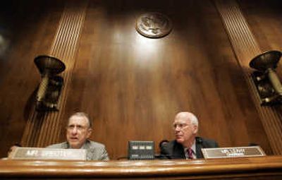 
Sen. Patrick Leahy, D-Vt., right, listens as Sen. Arlen Specter, R-Pa.,  asks a question of White House aide Scott Jennings in Washington on Thursday about the U.S. attorney firings. Associated Press
 (Associated Press / The Spokesman-Review)