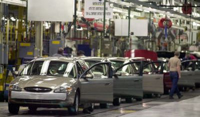 
A Ford Taurus assembly line is shown in  Chicago  in 2002. Ford is giving up on what some call the most influential automobile since the  Model T. 
 (File Associated Press / The Spokesman-Review)