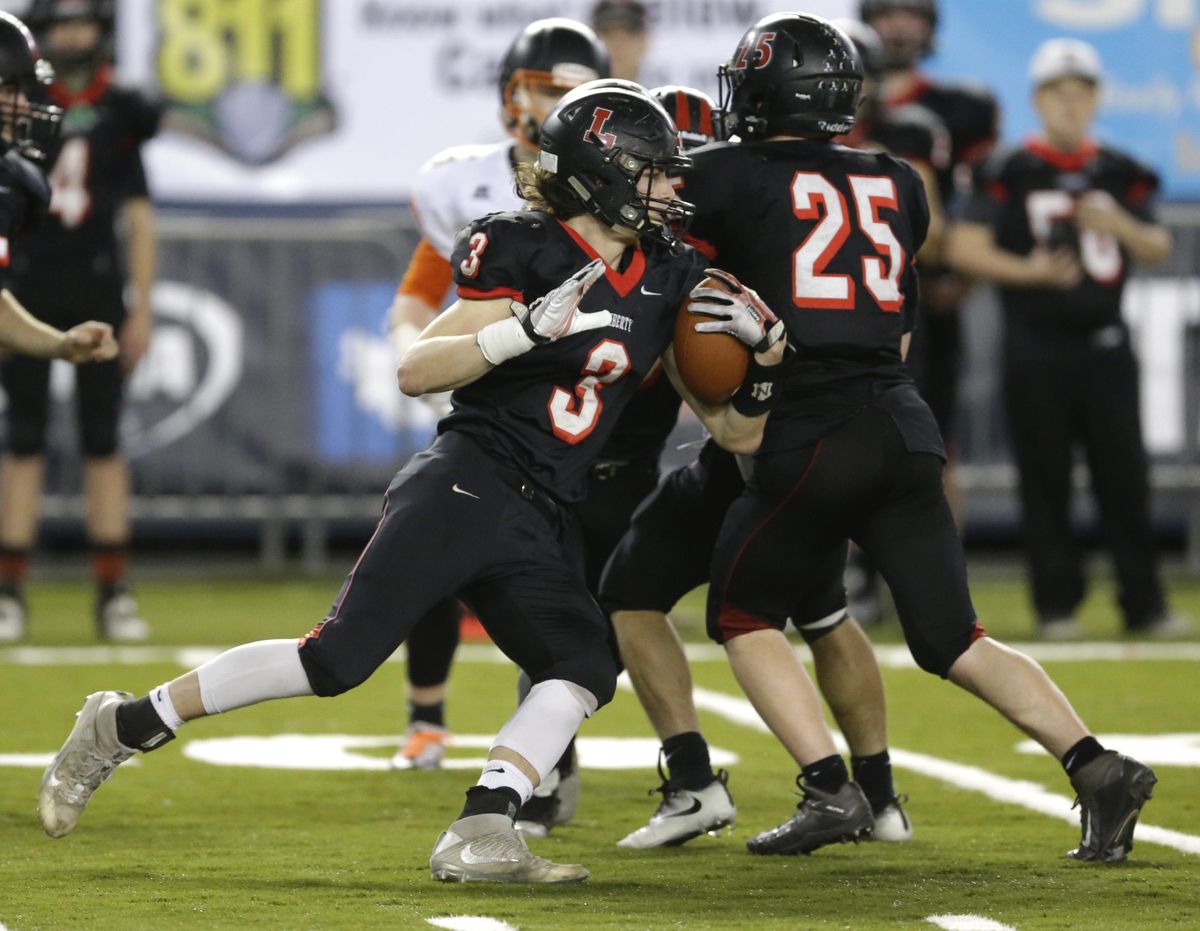Liberty’s Chase Burnham (3) returns a kickoff against Napavine in the second half. (Ted S. Warren / Associated Press)