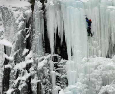
An ice climber takes advantage of an extreme cold snap  to climb in Harts Location, N.H., on Tuesday. Arctic air stretched from the northern Plains through New England, causing at least 11 deaths.
 (Associated Press / The Spokesman-Review)