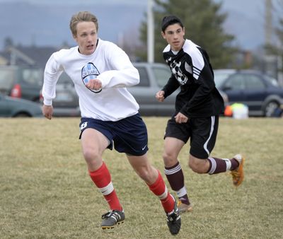 Top returners for the Central Valley soccer team include Karl Ellingson, left, and Miguel Naves, shown during practice on Tuesday at Central Valley High School. Below, goalie Andrew Enzler, left, punches the ball away from teammate Gabe Grabowski, right, during corner kick practice. (Jesse Tinsley)