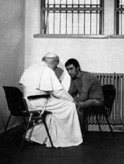 
John Paul II talks with his would-be assassin Mehmet Ali Agca in Agca's prison cell in Rome in this Dec. 27, 1983, photo. 
 (File/Associated Press / The Spokesman-Review)