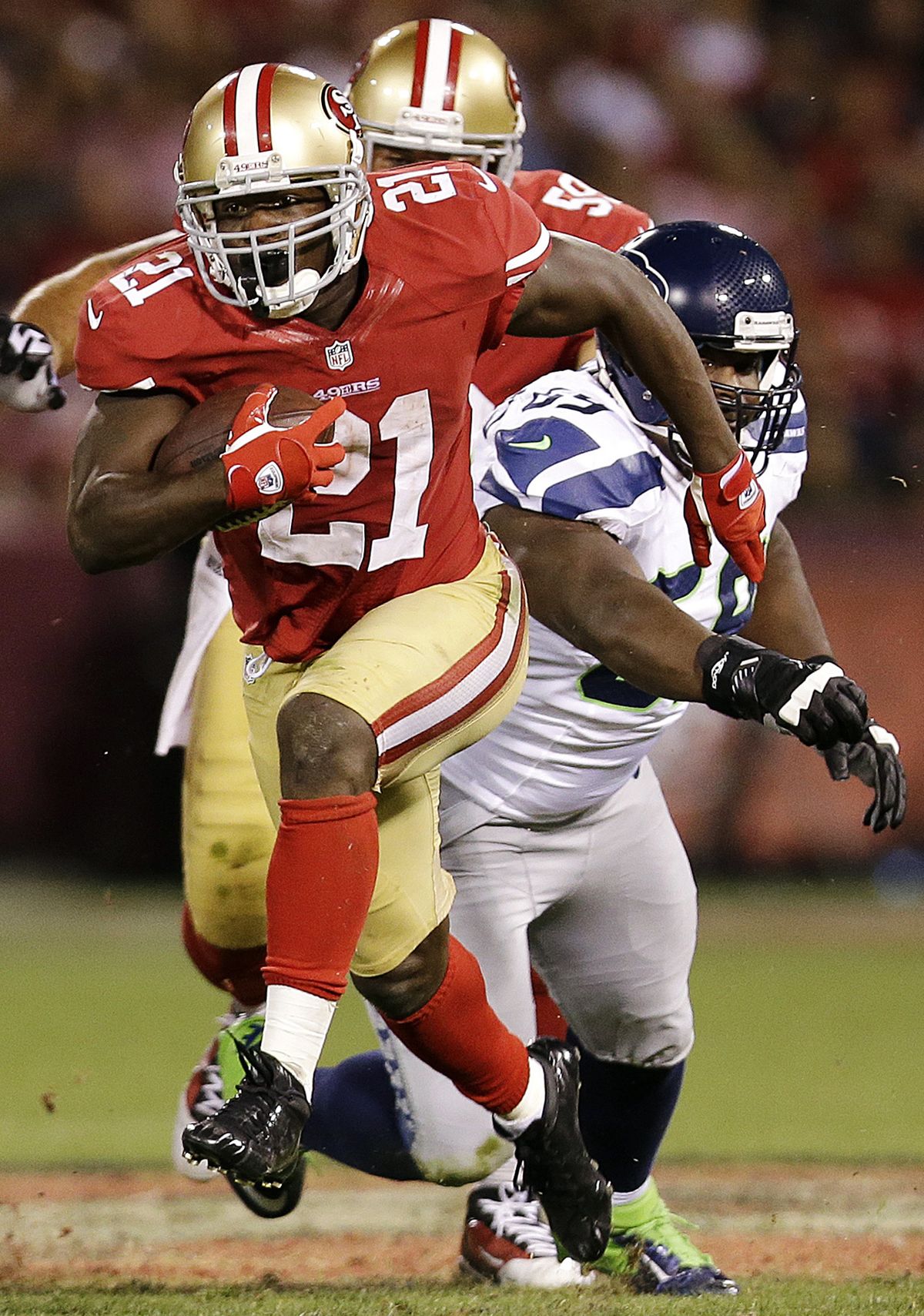 49ers RB Frank Gore, left, rushed 16 times for 131 yards against the Seahawks on Thursday night. (Associated Press)