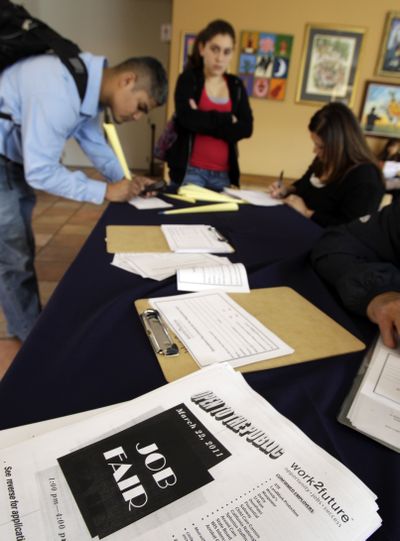 Applicants fill out forms at a job fair in San Jose, Calif., last month. The private sector added more than 200,000 jobs for a second straight month in March – the first time that’s happened since 2006. (Associated Press)