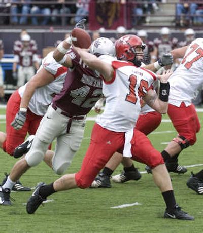 EWU's Matt Nichols beats the pass rush of UM's Jace Palmer. Associated Press
(Associated Press / The Spokesman-Review)